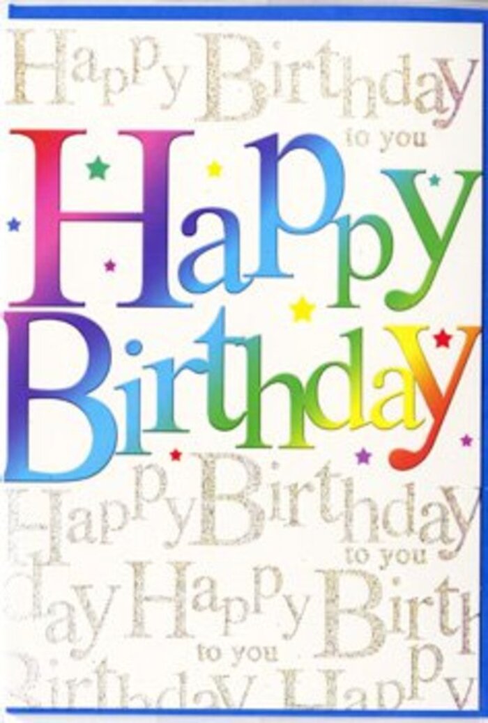 The image shows a birthday card whose artwork combines playful colour with refined detail, creating a design that feels just as at home in a Marylebone townhouse as in a cosy café near Baker Street. At the heart of the card, the phrase Happy Birthday is rendered in oversized letters that stretch across the centre, each character bathed in a luminous rainbow gradient. The colours shift in a gentle, fluid manner-crimson sliding into rosy pink, then into tangerine and soft amber, before turning to zesty lime, emerald, aqua, and finally into tranquil blues and purples. This smooth blending gives the lettering a sense of motion, as if the colours are slowly drifting across the surface like petals swirling in a vase. The letters are broad and rounded, with edges that feel friendly and approachable, and they appear slightly raised, catching the light with a subtle satin finish. Behind this main message, a delicate pattern of handwritten text fills the background. The phrase Happy Birthday to you is repeated line after line in fine, looping gold script, the metallic ink shimmering softly as if lit by candles on a birthday cake. The script weaves a gentle rhythm across the card, evoking the cadence of friends singing together at a celebration around Marylebone High Street. Small star-shaped accents and colourful specks are scattered thoughtfully between the lines of script, adding a light touch of festivity reminiscent of confetti. The overall composition balances exuberant colour with a clean, uncluttered layout, creating a card that feels both joyful and tasteful. It would pair beautifully with a bright, hand-crafted bouquet arranged just around the corner, making a birthday feel thoughtfully marked and genuinely special.