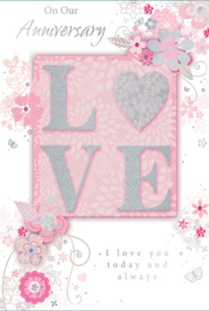 The anniversary card depicted here channels the feeling of a finely curated floral display you might spot near Marylebone's stylish lanes. The design centres on the word LOVE, its letters raised and coated with a frosted, glittering finish that mingles soft blush tones, creamy white shimmer, and small flashes of silver. This textured lettering glows subtly against a backdrop of warm blush pink, creating a focal point that feels both inviting and quietly celebratory. Radiating from around the central word is a graceful composition of stylised flowers and slender, curling leaves. These floral elements are drawn with delicate, flowing lines and gentle shading, suggesting blooms and foliage arranged with the eye of a professional florist rather than strict botanical realism. The palette remains soft and sophisticated, with whites and very pale pinks enhanced by touches of silver foil that trace certain petals and tendrils. These silver details catch any ambient light, adding refined sparkle reminiscent of evening strolls past lit shopfronts on Marylebone High Street. The card's surface looks subtly embossed where the flowers and letters rise from the page, offering a pleasing tactile contrast against the smooth background. Nestled amid this gentle swirl of florals is a sincere anniversary message in elegant script, its looping letters harmonising with the curved vines. The whole composition feels poised and intimate, like a paper counterpart to a hand-tied bouquet chosen for a quiet celebration at home. It speaks of enduring partnership, shared memories, and the kind of love that deepens with time in a neighbourhood as characterful as Marylebone.